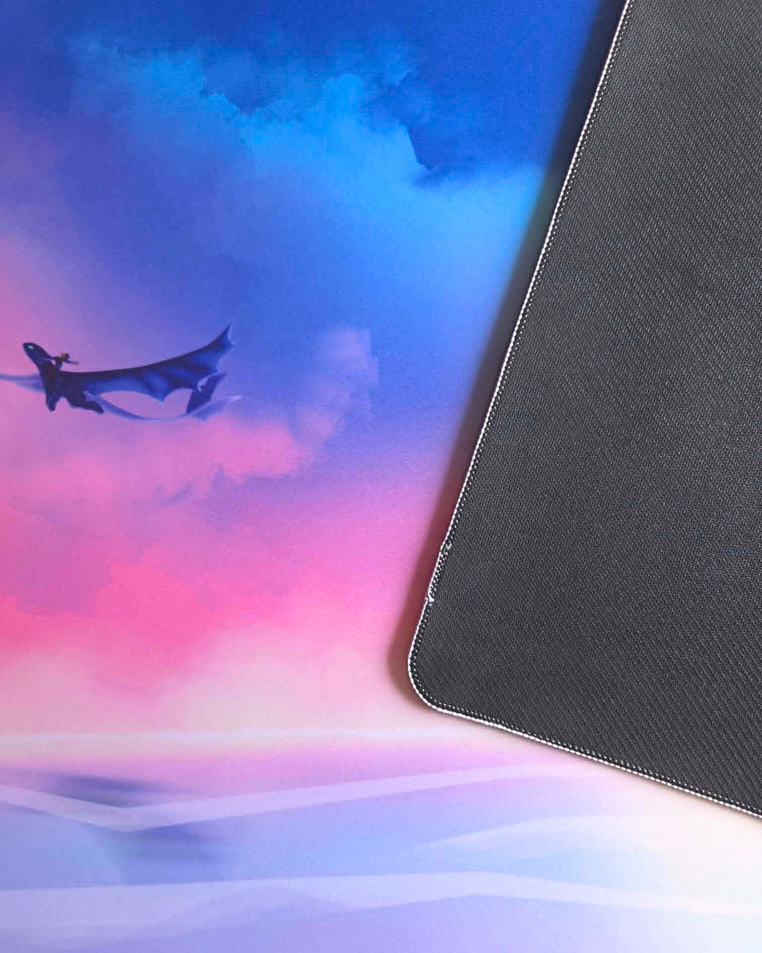 Colorful gradient background with a black silhouette of a dragon and a textured black surface.