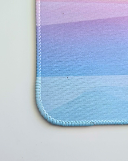 close up a mousepad with embroidered stitch edging
